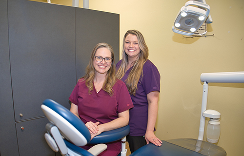 Dental Assistants Angie Temres and Kelsey Harmon smiling