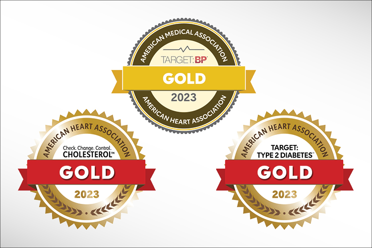 American Heart Association gold award seals for cholesterol (left), blood pressure (middle/top), and diabetes (right)
